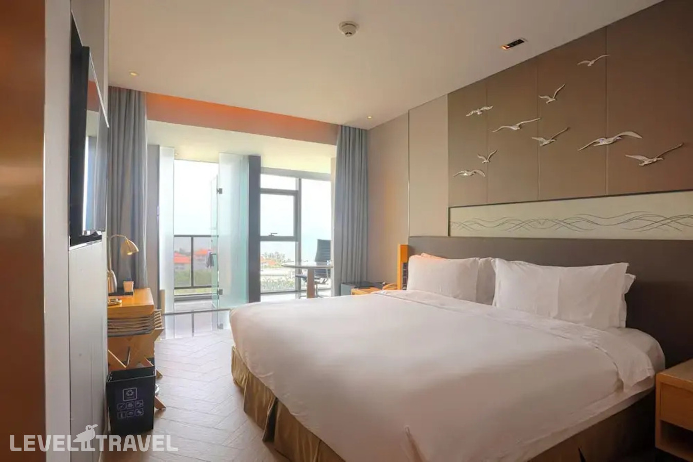 фотографии номера Стандартный номер отеля Holiday Inn Haikou West Coast, An Ihg Hotel в Китай(Хайкоу) - фото №3