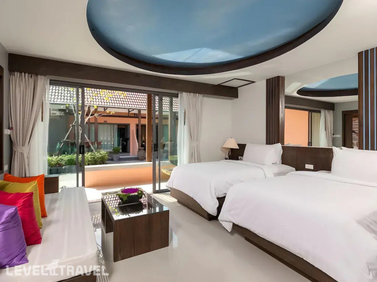 фотографии номера Делюкс с видом на сад с балконом отеля Naina Resort & Spa в Таиланд(Патонг Бич) - фото №4