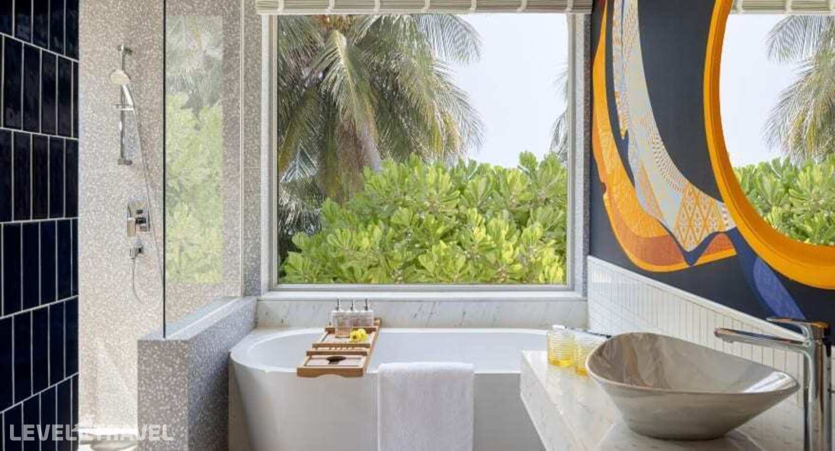 фотографии номера Премиум с видом на пляж (две односпальные кровати) отеля Avani+ Fares Maldives Resort в Мальдивы(Баа Атолл) - фото №4