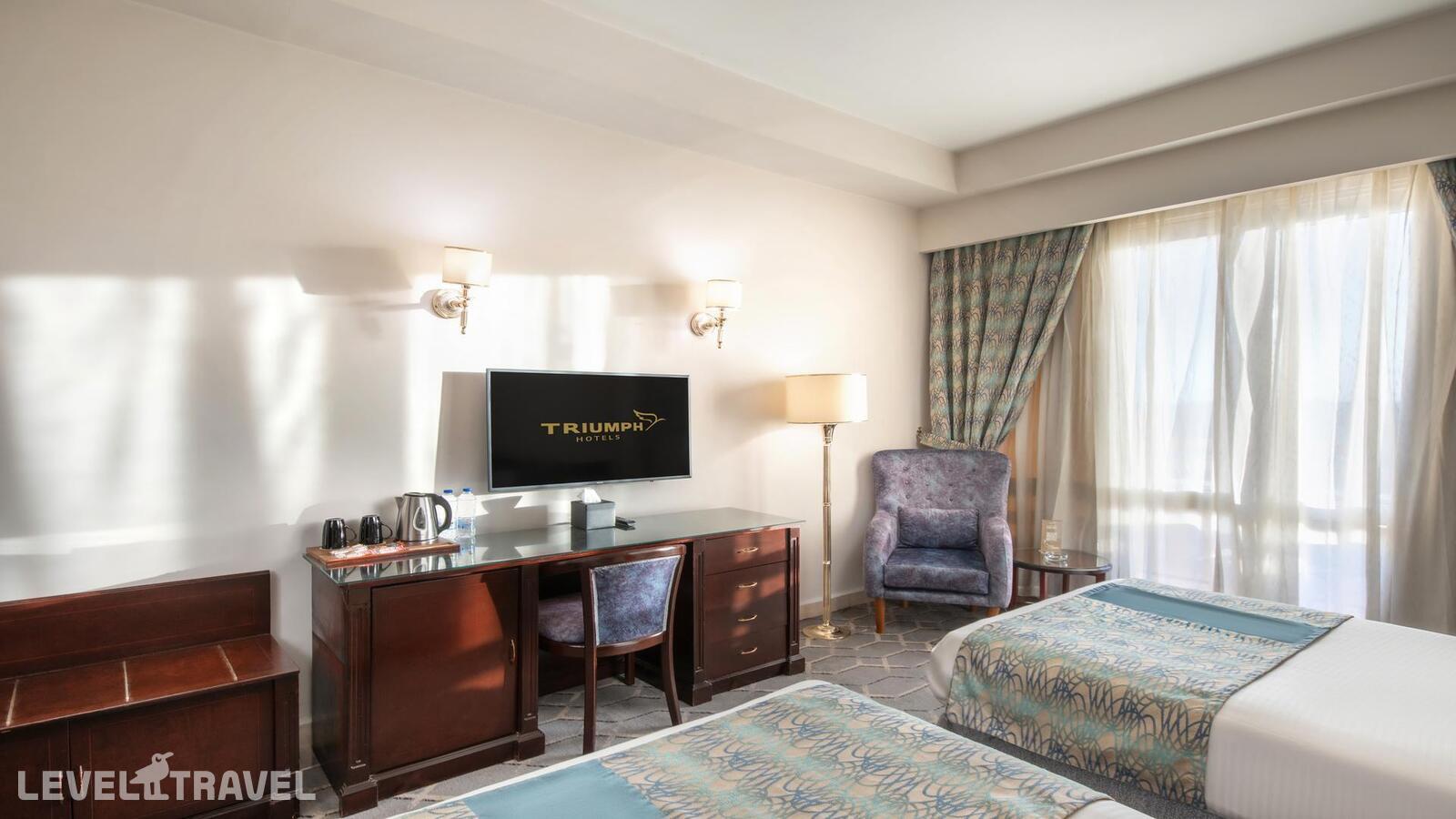 фотографии номера Стандартный (две односпальные кровати) отеля Triumph Plaza Hotel в Египет(Каир) - фото №1