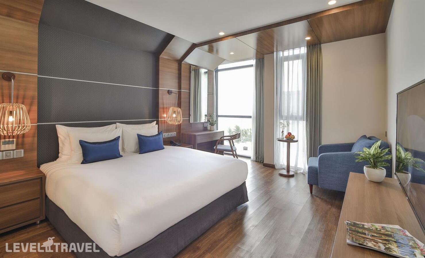 фотографии номера Номер Oasis с частичным видом на море отеля Haian Beach Hotel & Spa в Вьетнам(Дананг) - фото №1