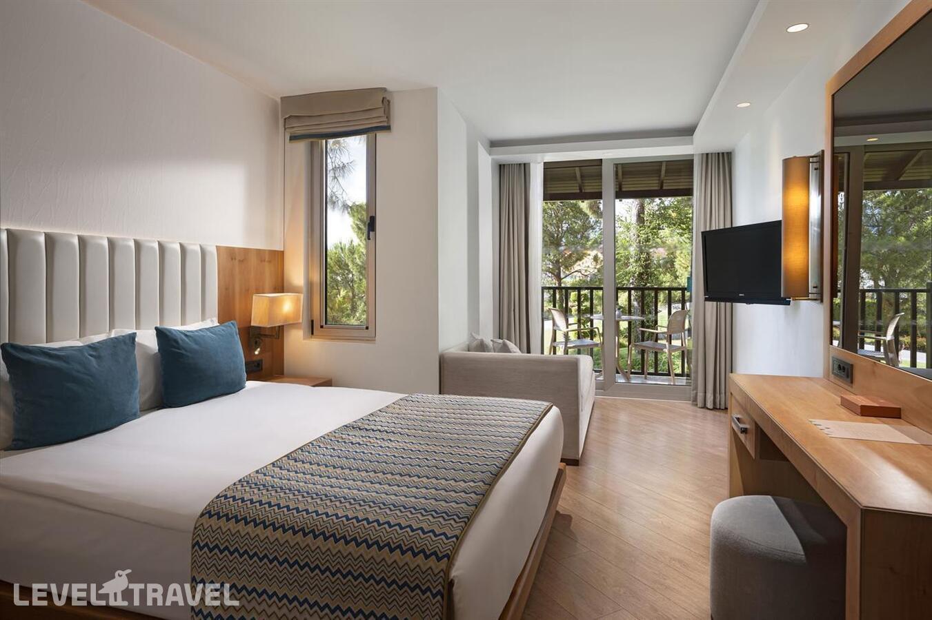 фотографии номера Стандартный с видом на сад отеля Liberty Hotels Lykia (Ex. Lykia World Oludeniz) в Турция(Олюдениз) - фото №1