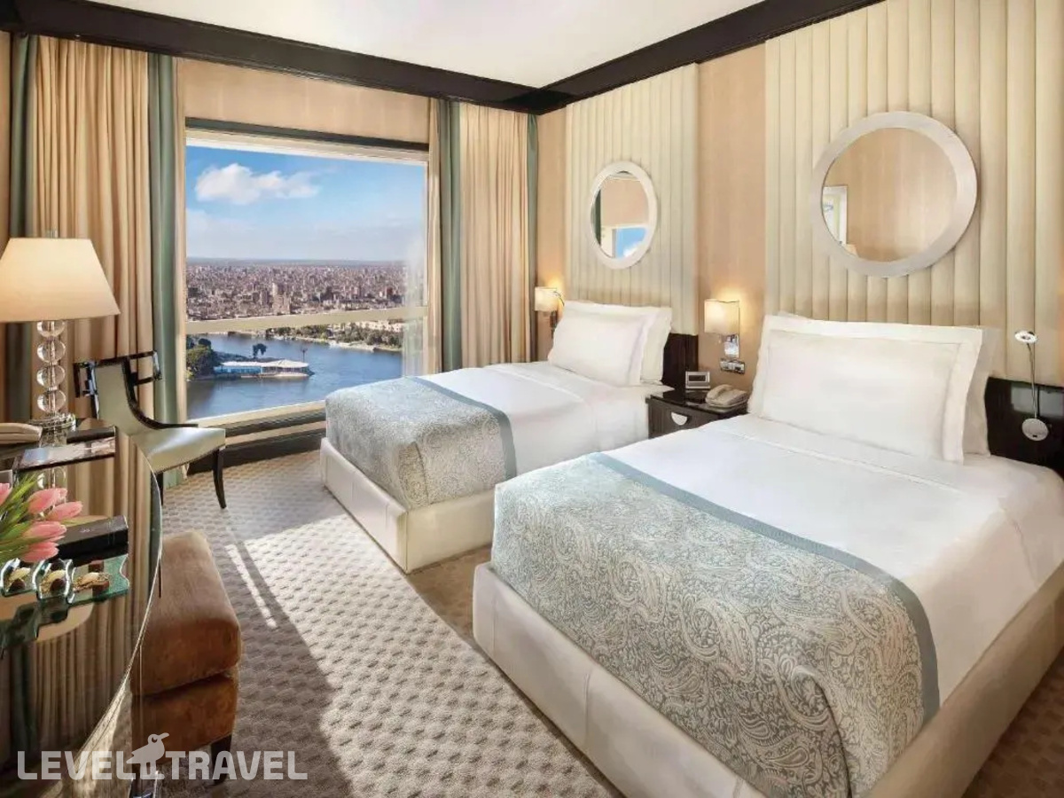 фотографии номера Номер Fairmont Gold с видом на реку отеля Fairmont Nile City в Египет(Каир) - фото №1