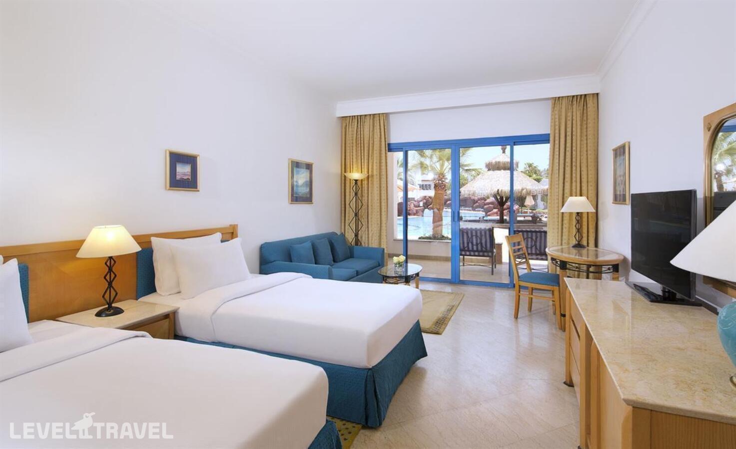 фотографии номера Улучшенный с видом на бассейн или море отеля Jaz Fayrouz Resort (Ex.Hilton Sharm Fayrouz Resort) в Египет(Наама Бэй) - фото №1