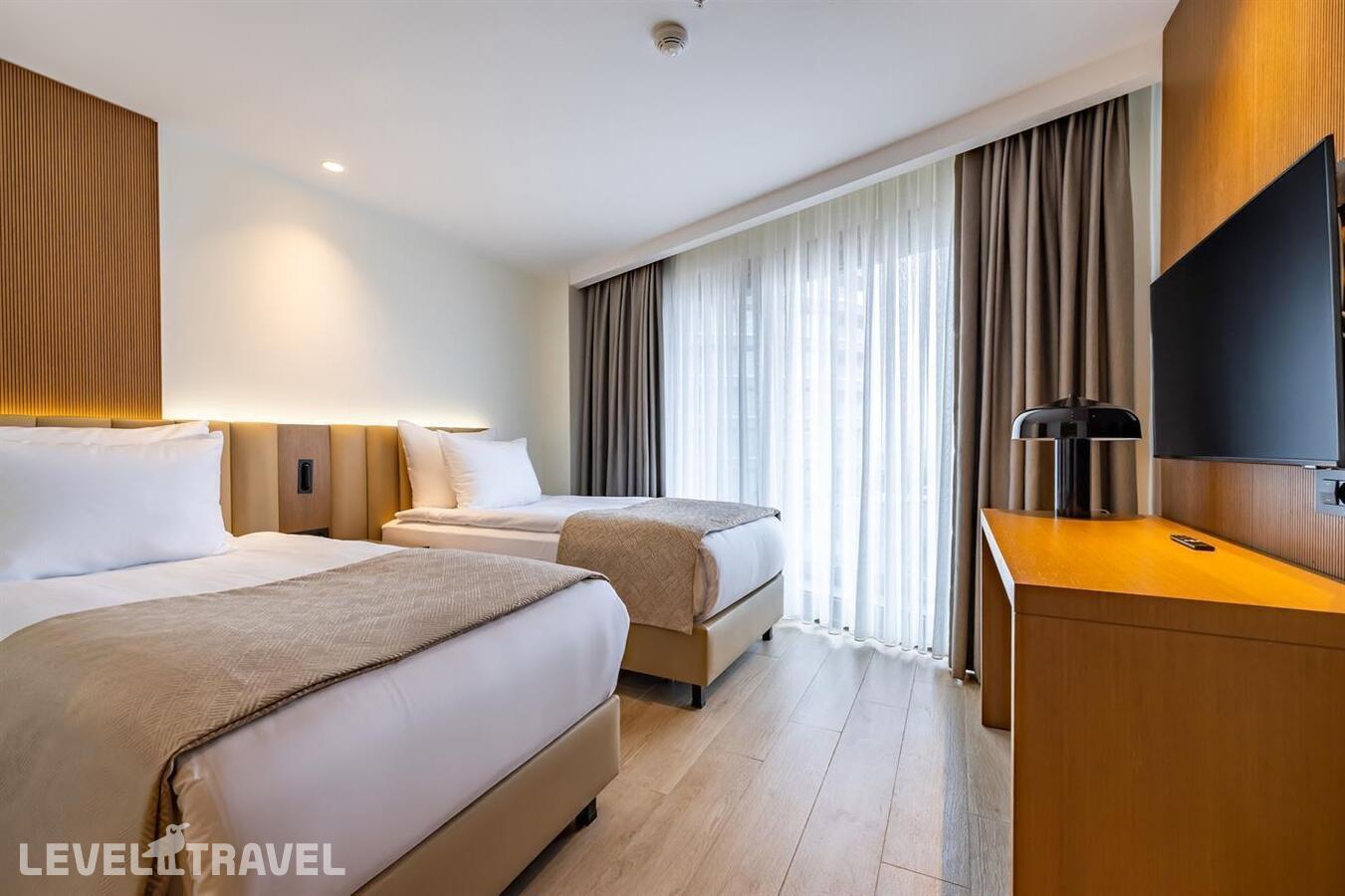 фотографии номера Семейный люкс с видом на окрестности отеля Beks Premium Resort & Spa в Турция(Кушадасы) - фото №1