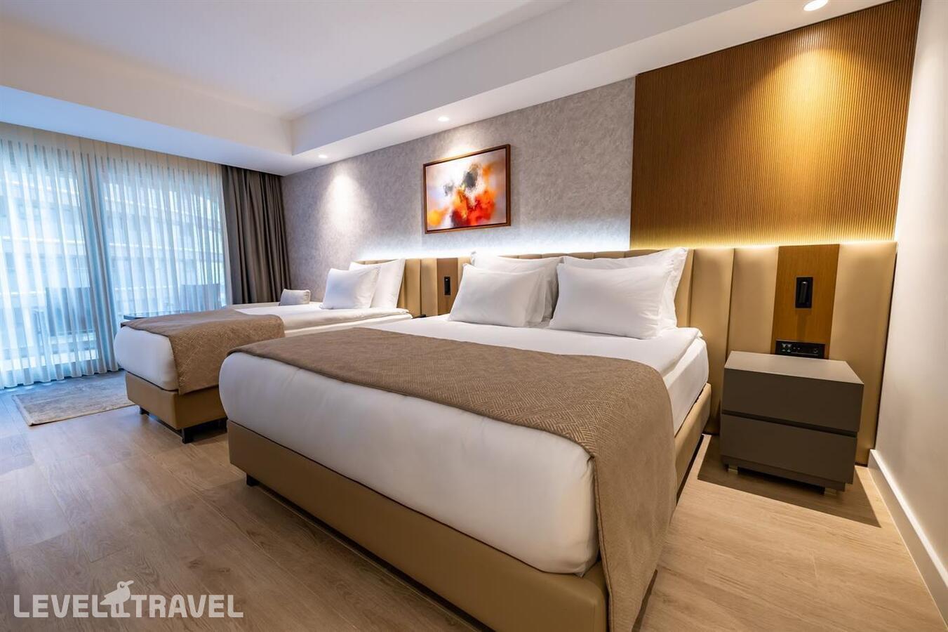 фотографии номера Делюкс с видом на окрестности отеля Beks Premium Resort & Spa в Турция(Кушадасы) - фото №1