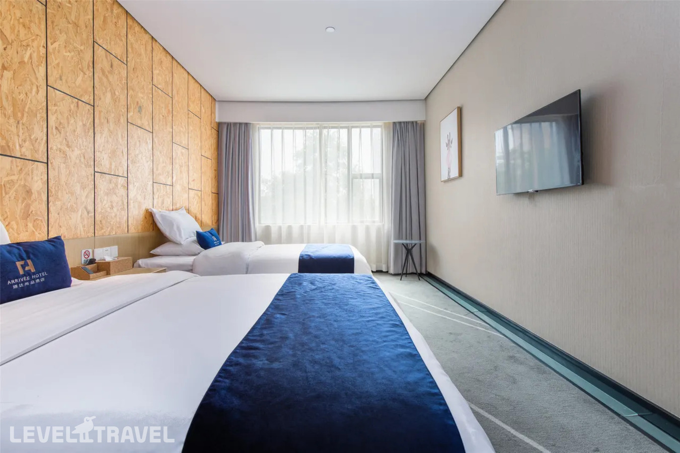 фотографии номера Делюкс (две односпальные кровати) отеля Arrivee Hotel в Китай(Гуанчжоу) - фото №2