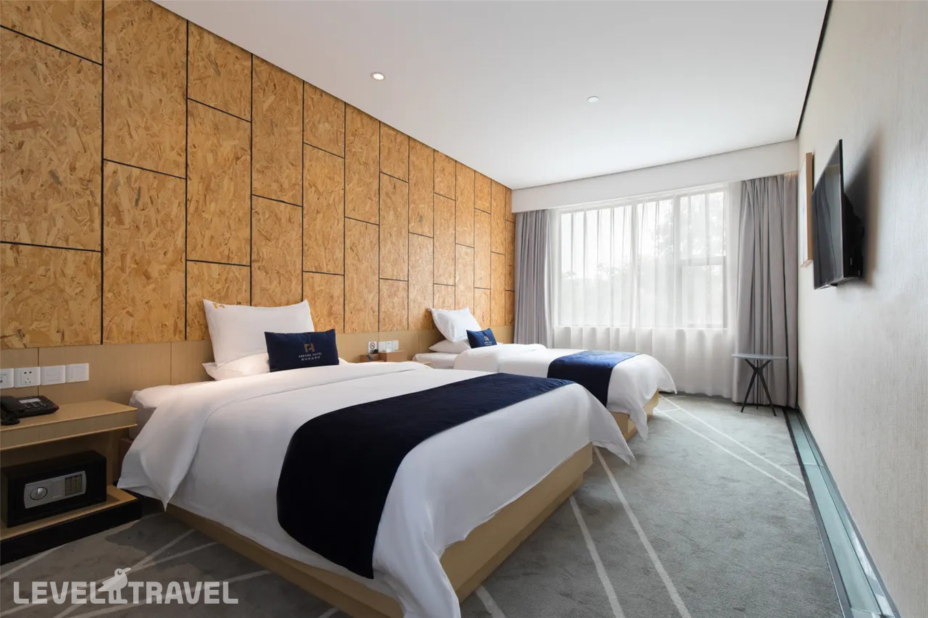 фотографии номера Делюкс (две односпальные кровати) отеля Arrivee Hotel в Китай(Гуанчжоу) - фото №1