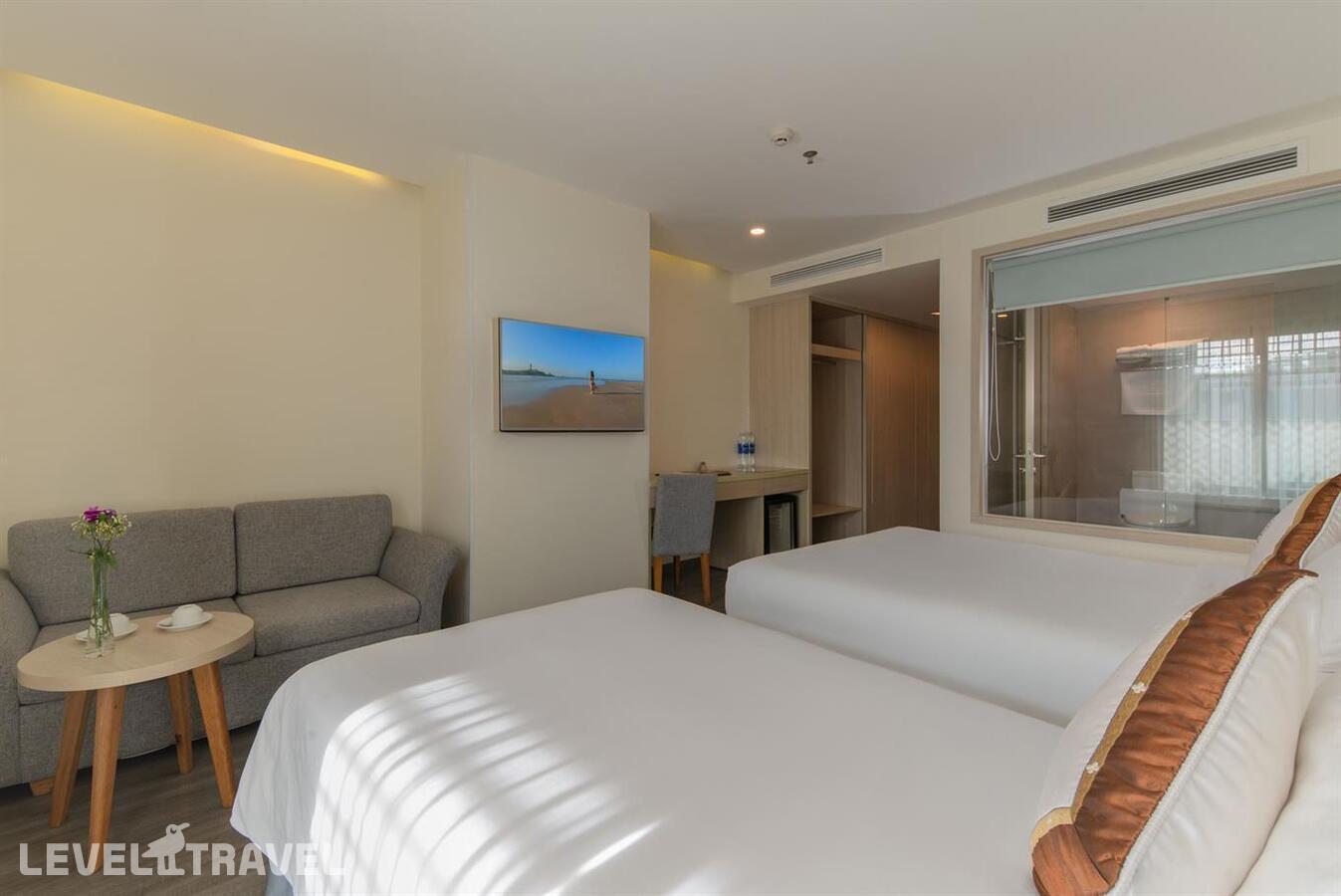 фотографии номера Делюкс (две односпальные кровати) отеля Stella Maris Nha Trang Hotel в Вьетнам(Нячанг) - фото №3