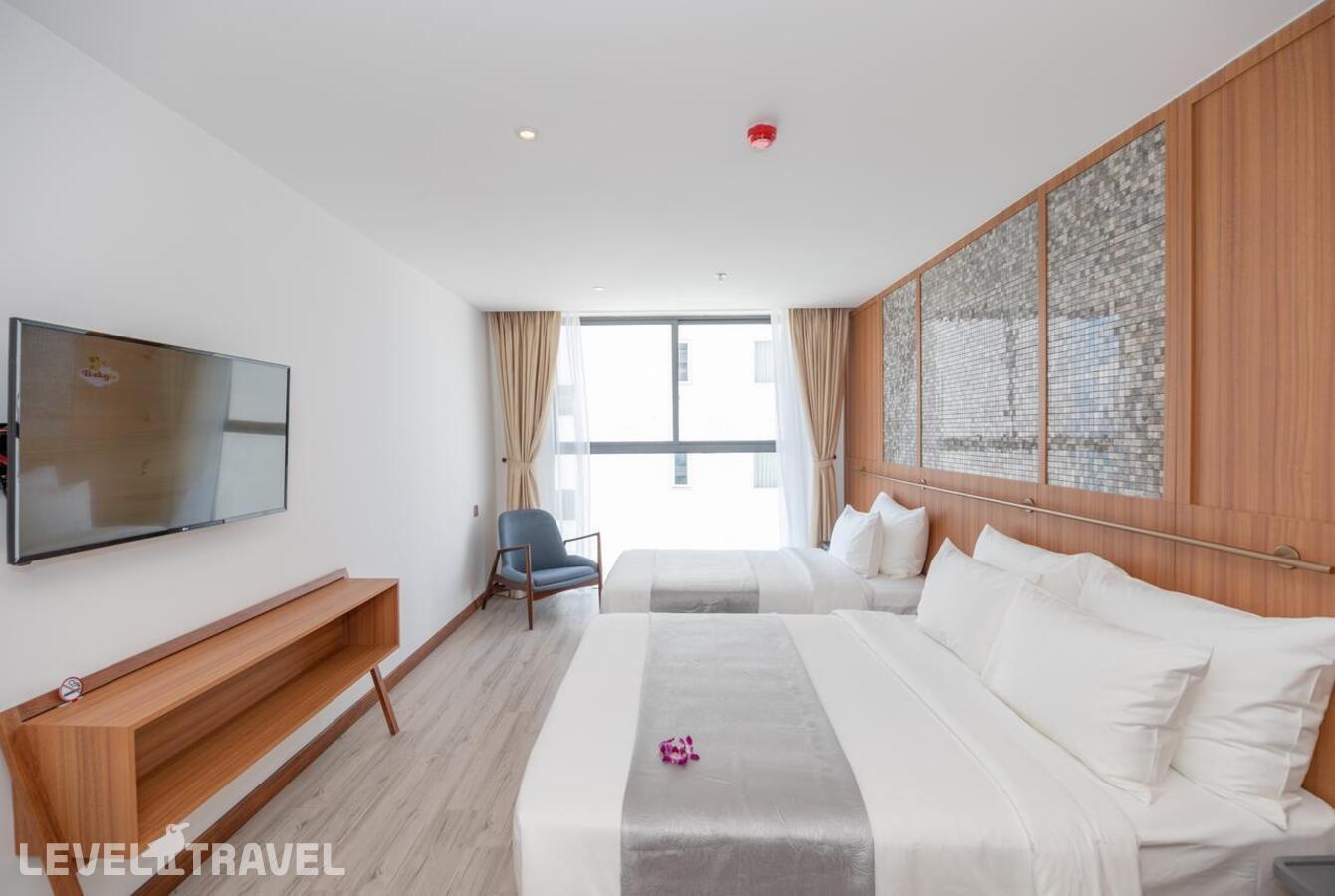 фотографии номера Трехместный делюкс с частичным видом на море отеля Majestic Premium Hotel в Вьетнам(Нячанг) - фото №1