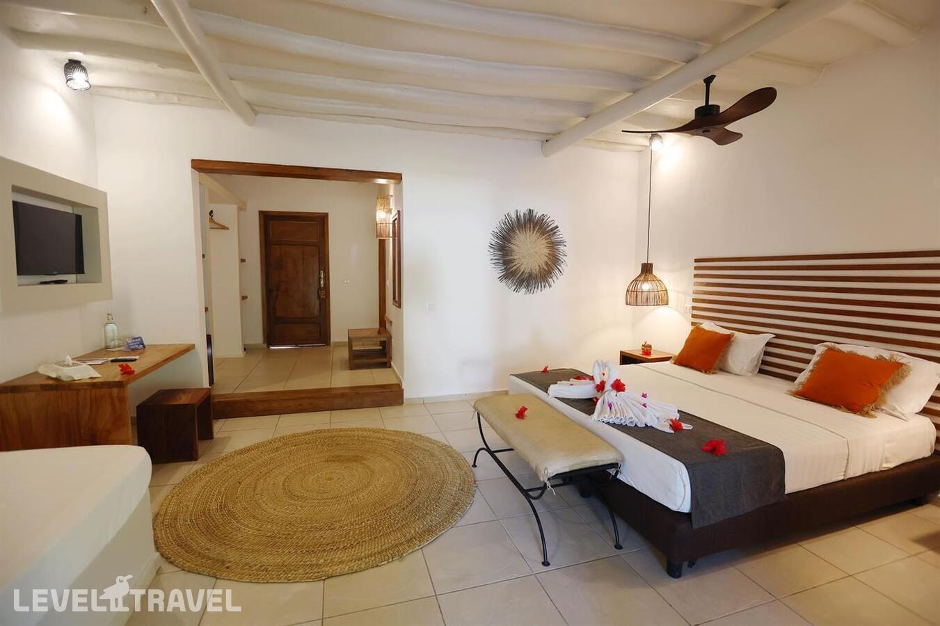 фотографии номера Стандартный с видом на сад отеля Karafuu Hotel Beach Resort в Танзания(Пингве Бич) - фото №1