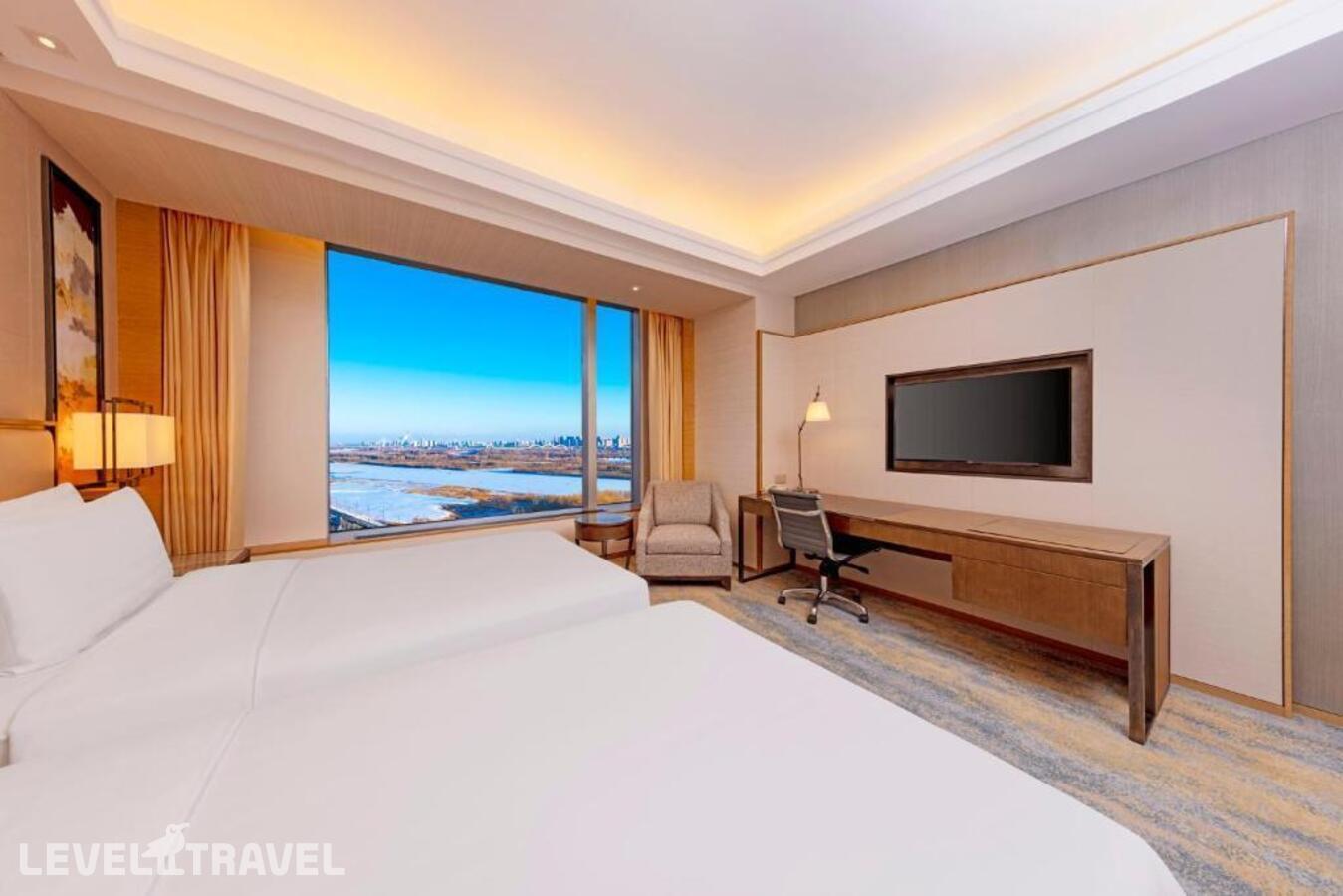 фотографии номера Делюкс с видом на реку отеля Shangri-La Songbei, Harbin в Китай(Харбин) - фото №2