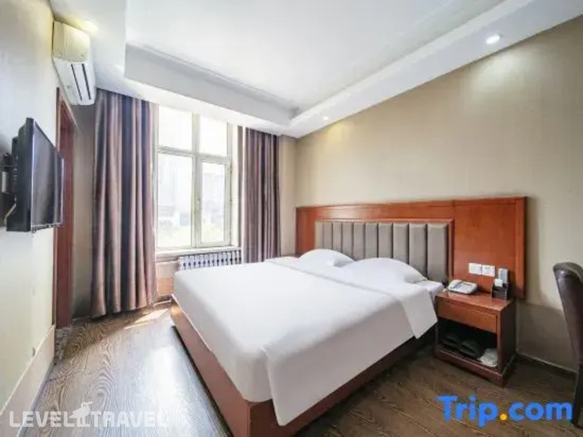 фотографии номера Семейный номер отеля Huaxi Hotel в Китай(Харбин) - фото №4