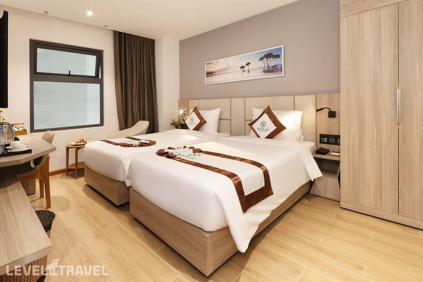 фотографии номера Улучшенный (две односпальные кровати) отеля Nalicas Hotel в Вьетнам(Нячанг) - фото №1
