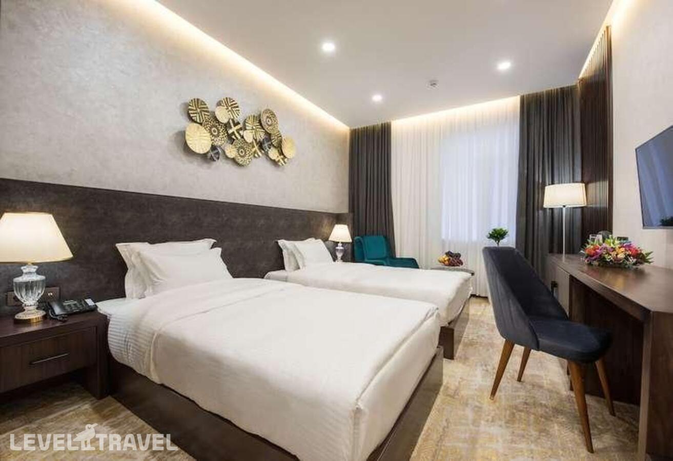 фотографии номера Стандартный (две односпальные кровати) отеля Wyndham Garden Tashkent (Ex. Regal Stay) в Узбекистан(Ташкент) - фото №3