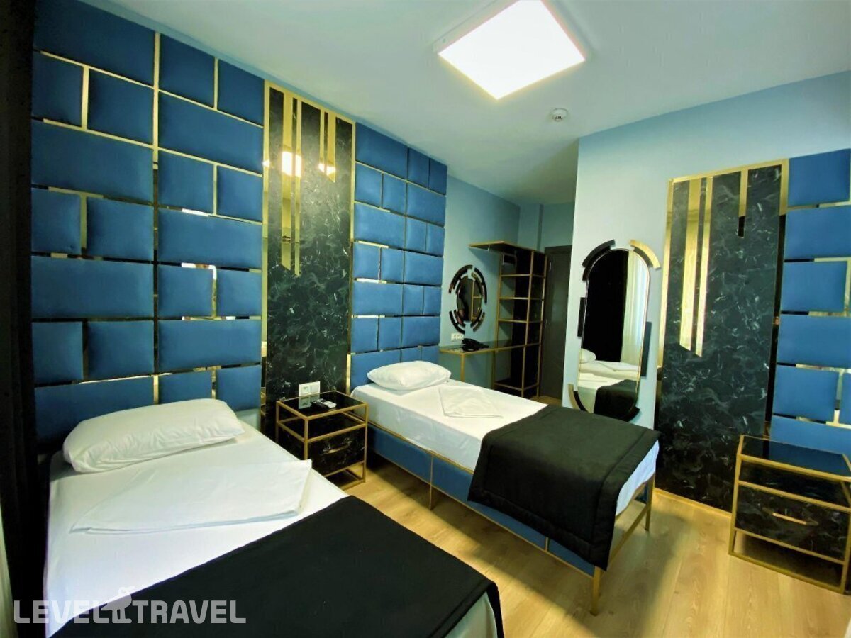 фотографии номера Четырехместный номер отеля Orange Airport Hotel в Турция(Бахчелиэвлер) - фото №7