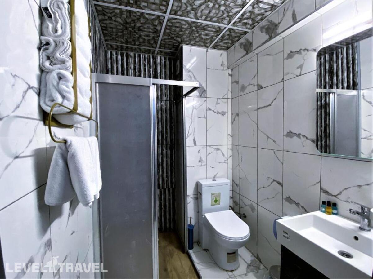 фотографии номера Четырехместный номер отеля Orange Airport Hotel в Турция(Бахчелиэвлер) - фото №3