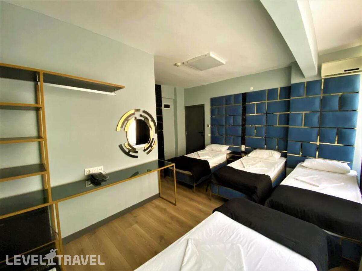 фотографии номера Четырехместный номер отеля Orange Airport Hotel в Турция(Бахчелиэвлер) - фото №2