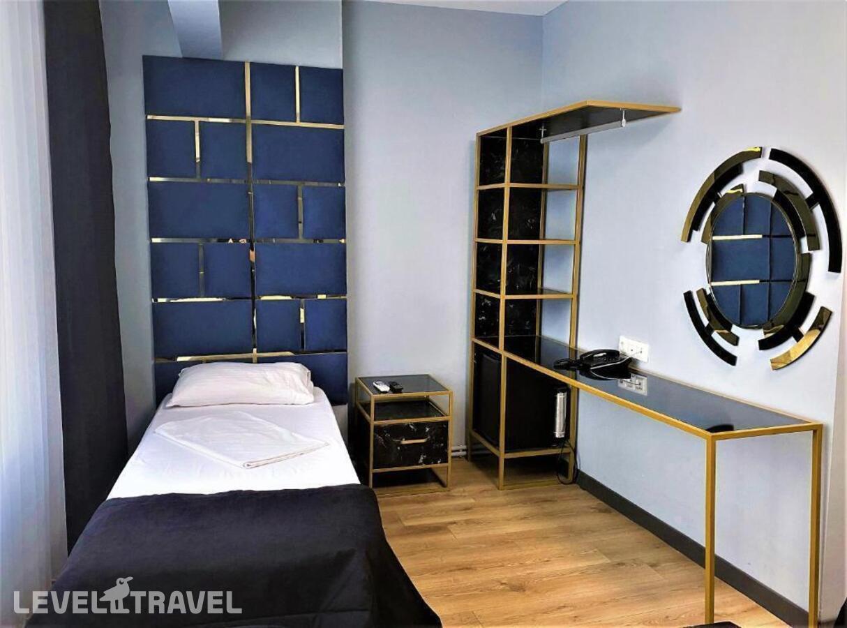 фотографии номера Четырехместный номер отеля Orange Airport Hotel в Турция(Бахчелиэвлер) - фото №1