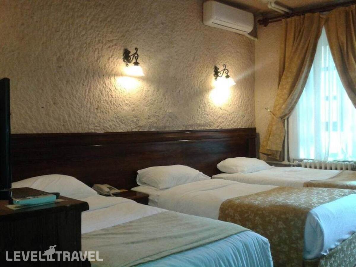 фотографии номера Трехместный номер отеля Burcu Kaya Hotel в Турция(Ортахисар) - фото №2