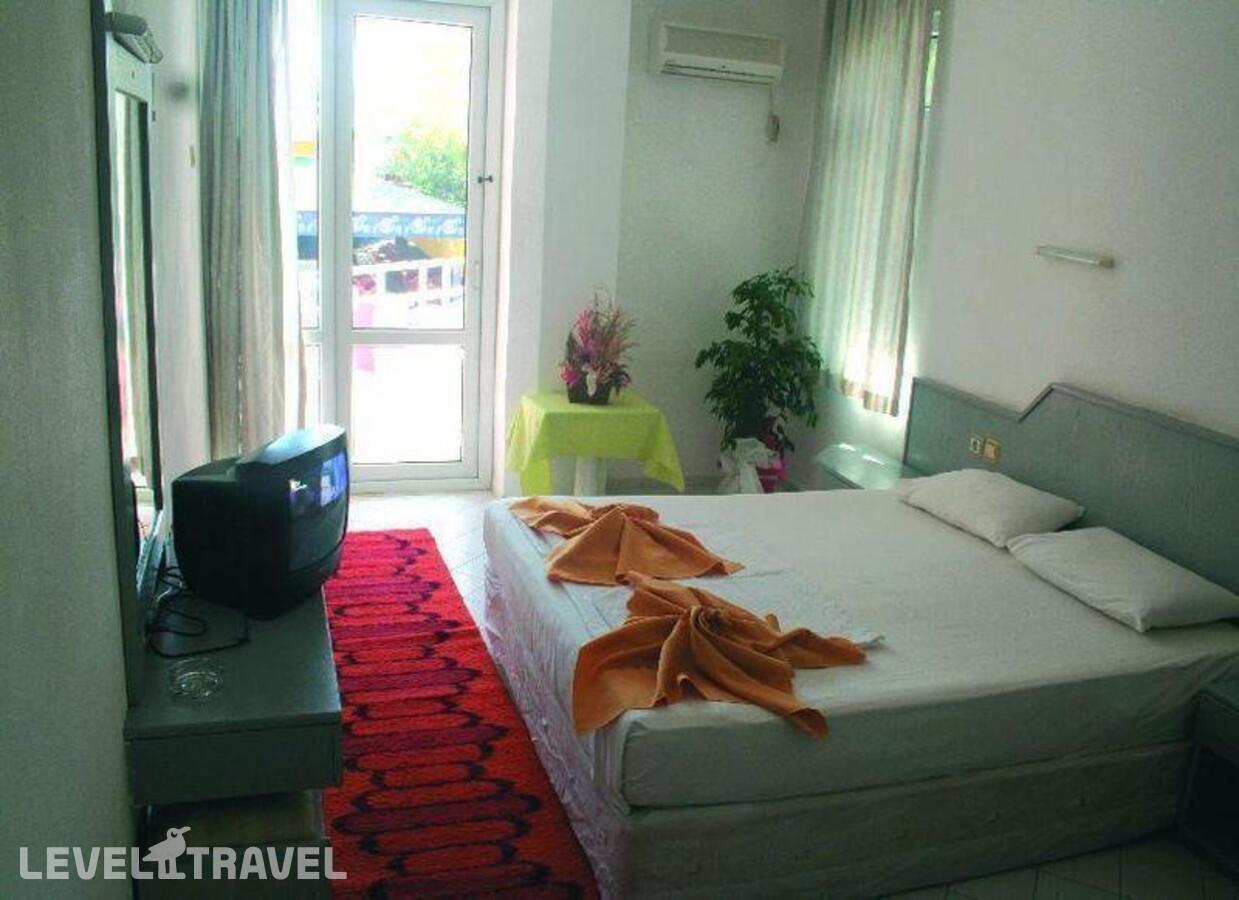 фотографии номера Трехместный номер отеля Bariscan Hotel в Турция(Махмутлар) - фото №1