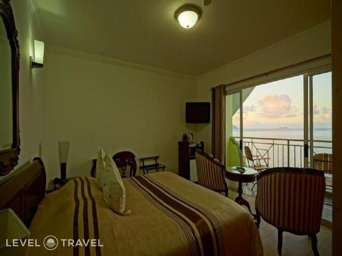 фотографии номера Стандартный номер отеля Treasure Cove Hotel в Сейшелы(о. Маэ) - фото №2