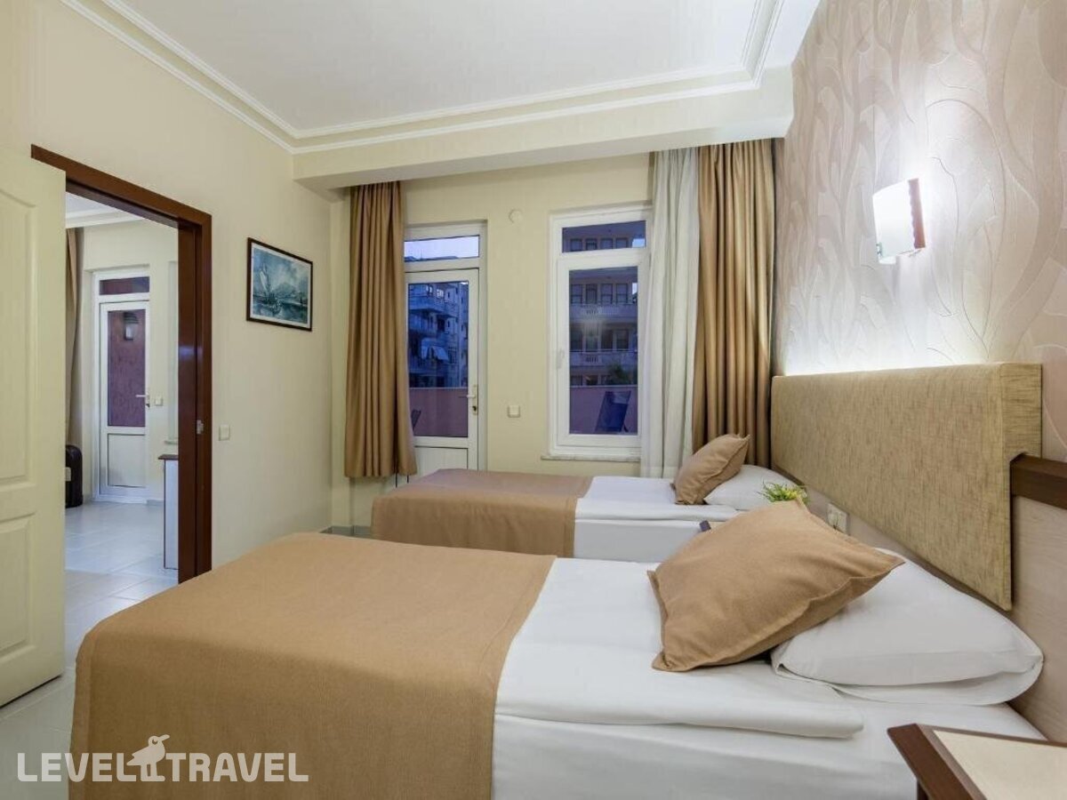 фотографии номера Четырехместные апартаменты отеля May Flower App Hotel в Турция(Аланья - центр) - фото №2