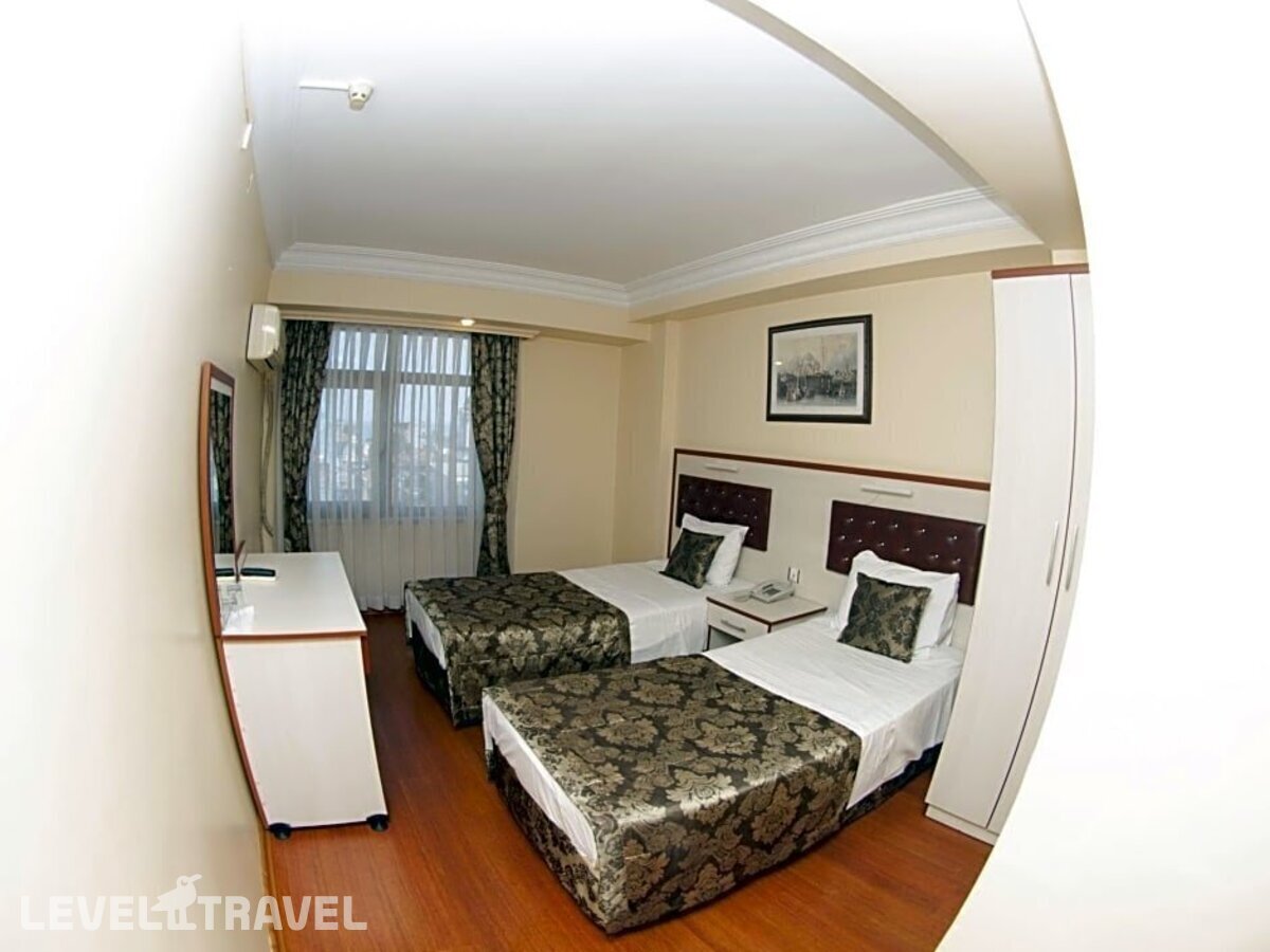 фотографии номера Семейный номер отеля Tayhan Hotel в Турция(Фатих) - фото №3