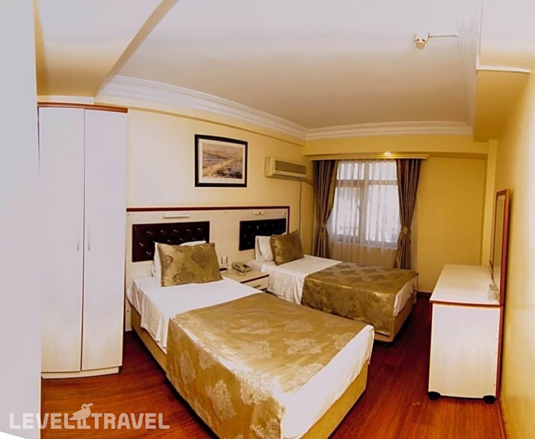 фотографии номера Семейный номер отеля Tayhan Hotel в Турция(Фатих) - фото №2