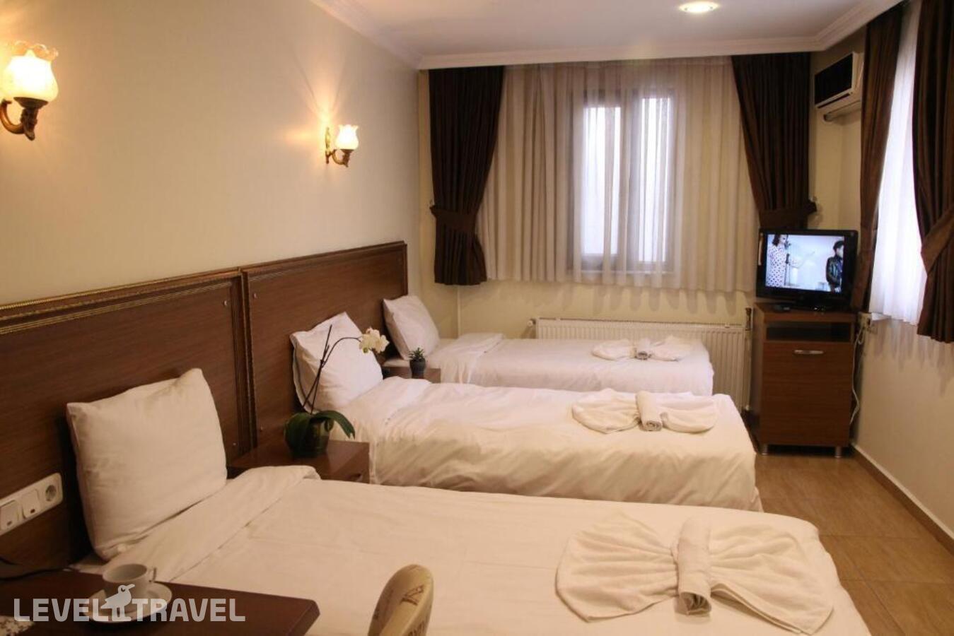 фотографии номера Трехместный номер отеля Rio Hotel в Турция(Лалели) - фото №6