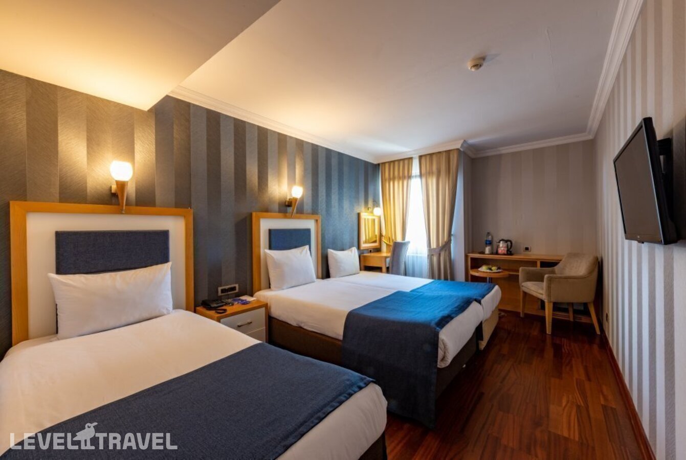 фотографии номера Трехместный номер отеля Aven Hotel (Ex. Nova Plaza Taksim Square) в Турция(Бейоглу) - фото №2