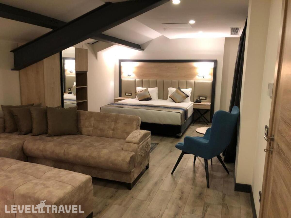 фотографии номера Люкс президентский отеля Ramada Encore By Wyndham Basin Express в Турция(Кючюкчекмедже) - фото №2