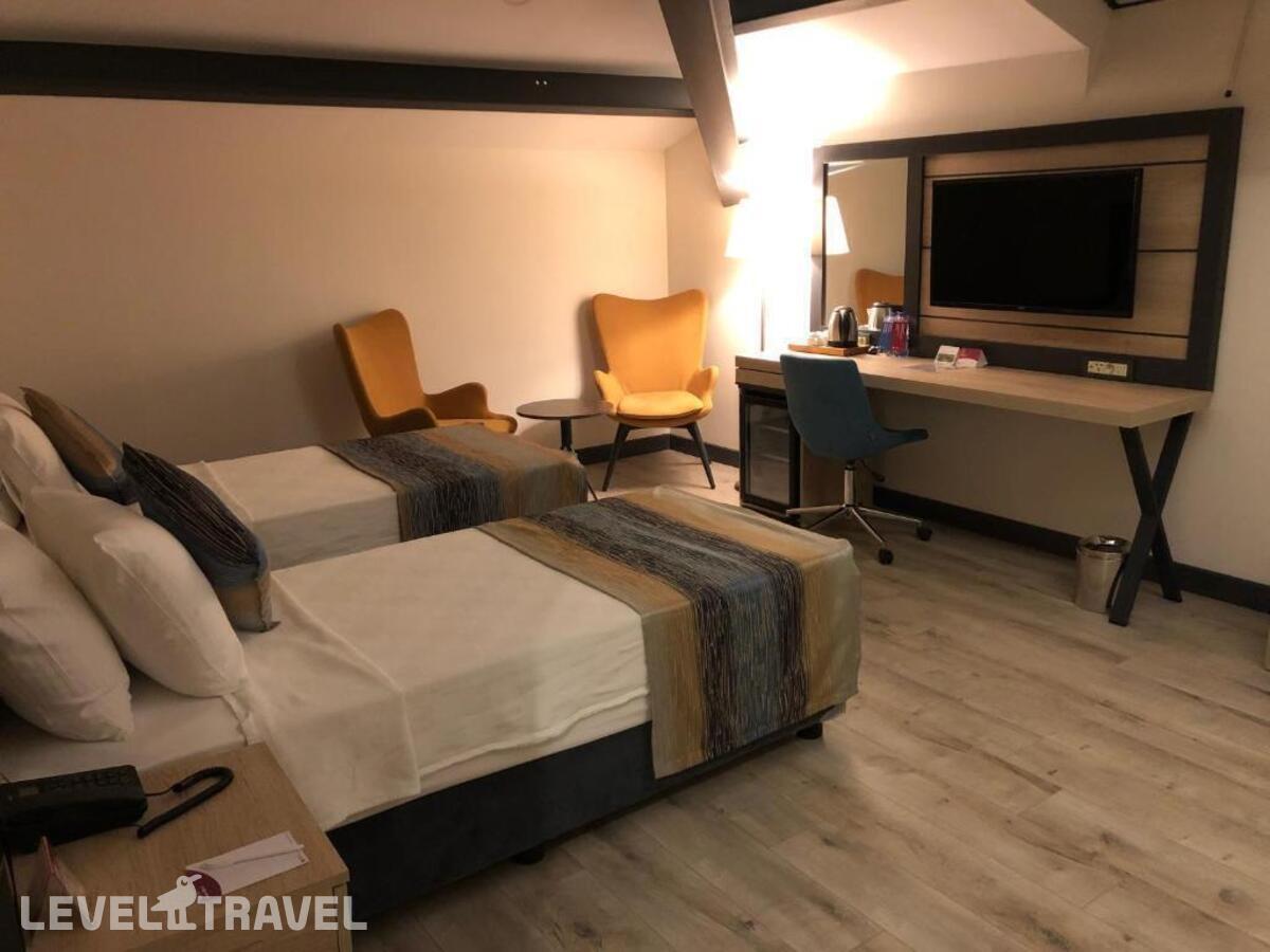 фотографии номера Люкс президентский отеля Ramada Encore By Wyndham Basin Express в Турция(Кючюкчекмедже) - фото №4