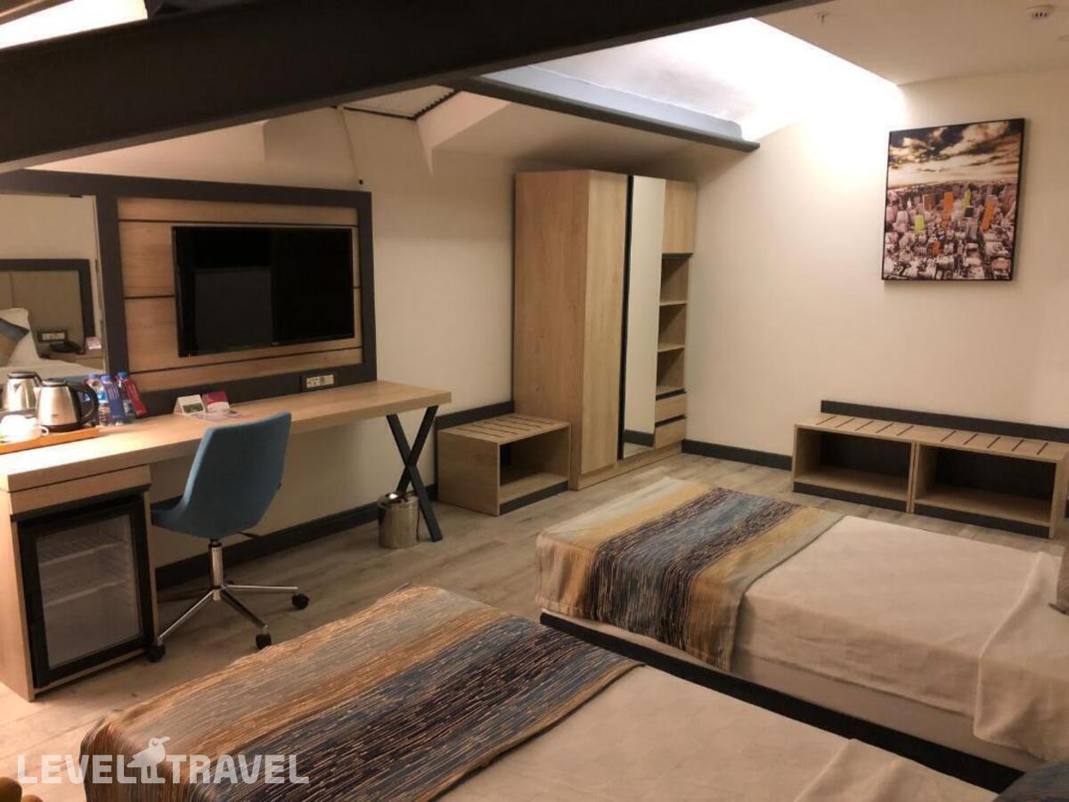фотографии номера Люкс президентский отеля Ramada Encore By Wyndham Basin Express в Турция(Кючюкчекмедже) - фото №3