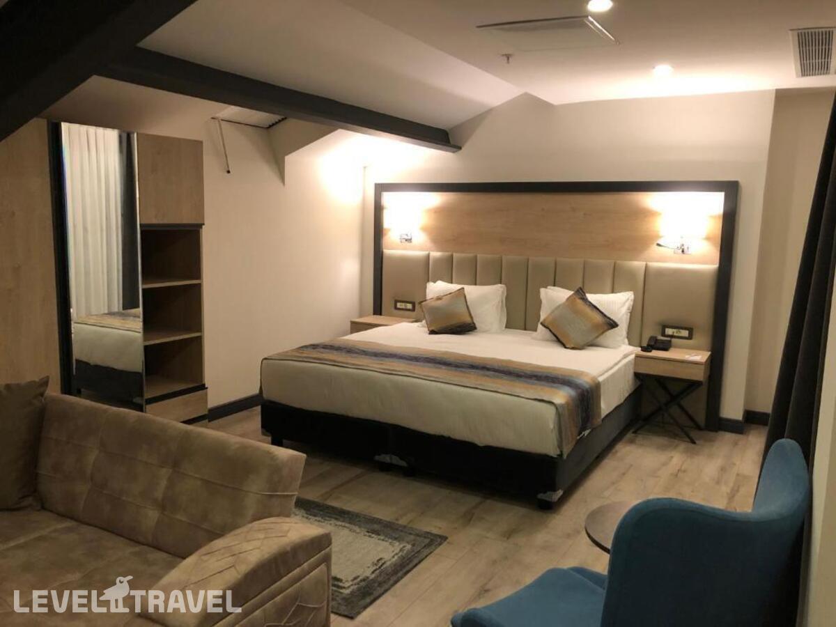 фотографии номера Люкс президентский отеля Ramada Encore By Wyndham Basin Express в Турция(Кючюкчекмедже) - фото №1