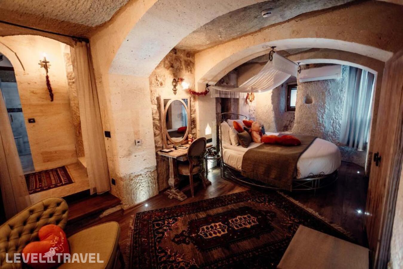 фотографии номера Люкс роскошный отеля Tafoni Houses Cave Hotel в Турция(Ортахисар) - фото №3