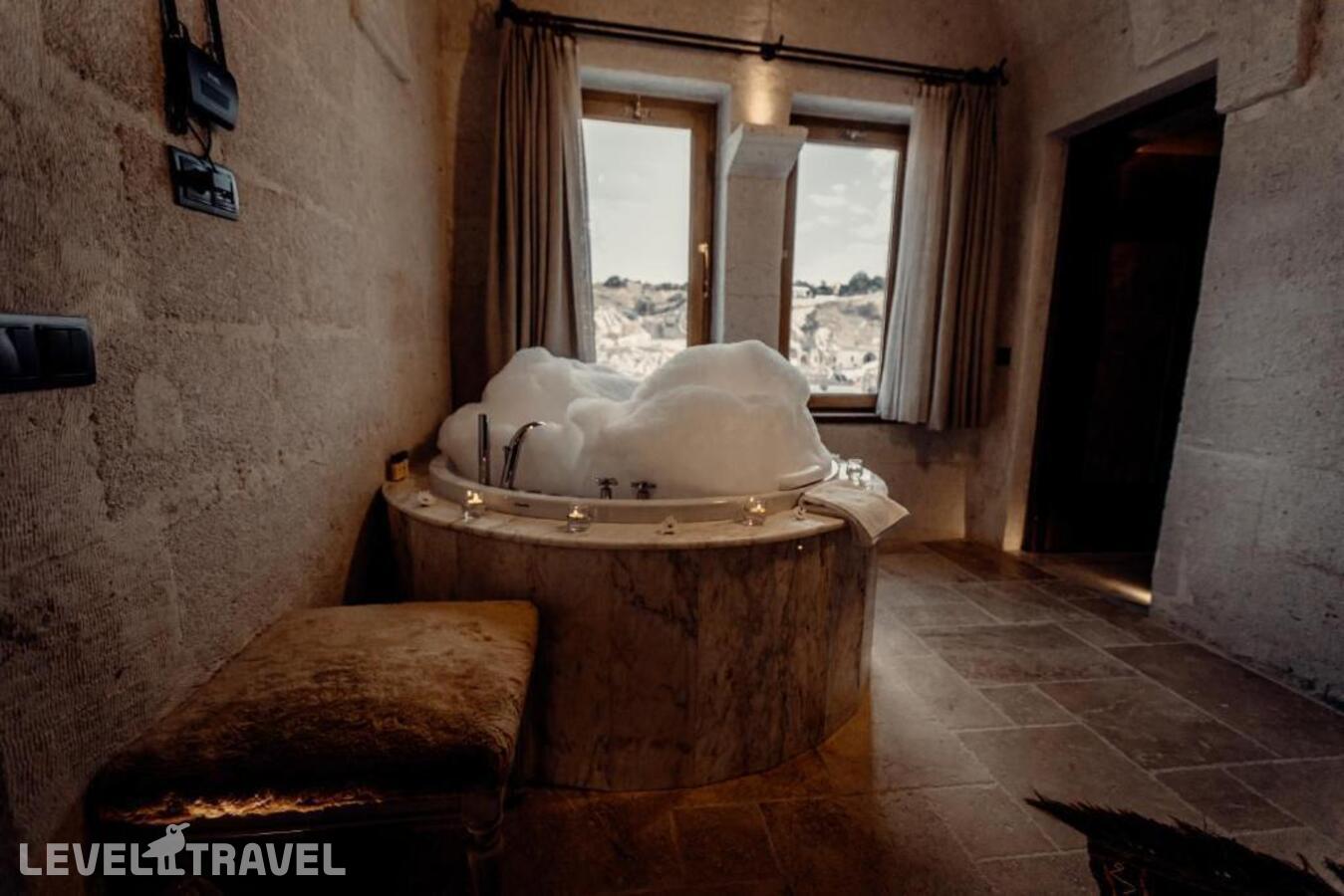 фотографии номера Люкс роскошный отеля Tafoni Houses Cave Hotel в Турция(Ортахисар) - фото №8