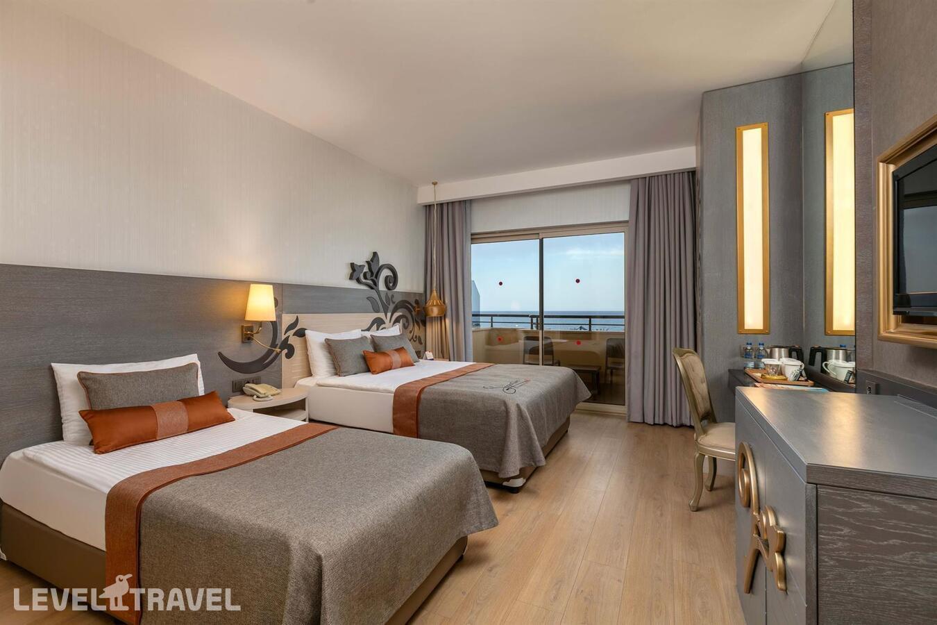фотографии номера Стандартный с видом на море отеля Kirman Belazur Resort & Spa в Турция(Богазкент) - фото №1