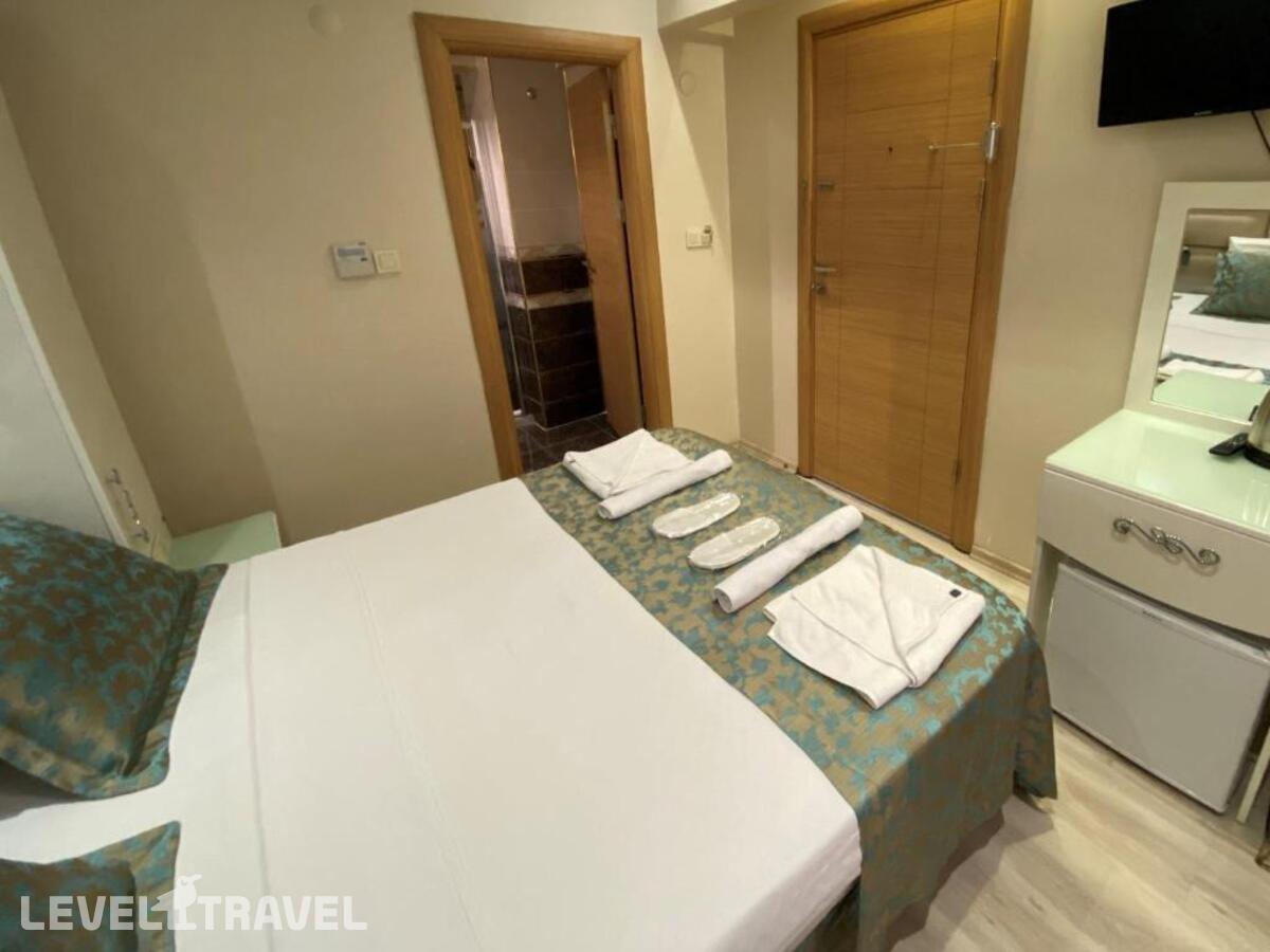 фотографии номера Экономичный номер отеля Reyyan Hotel в Турция(Фатих) - фото №2