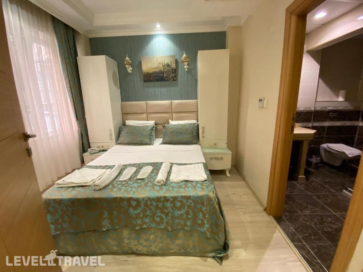фотографии номера Экономичный номер отеля Reyyan Hotel в Турция(Фатих) - фото №1