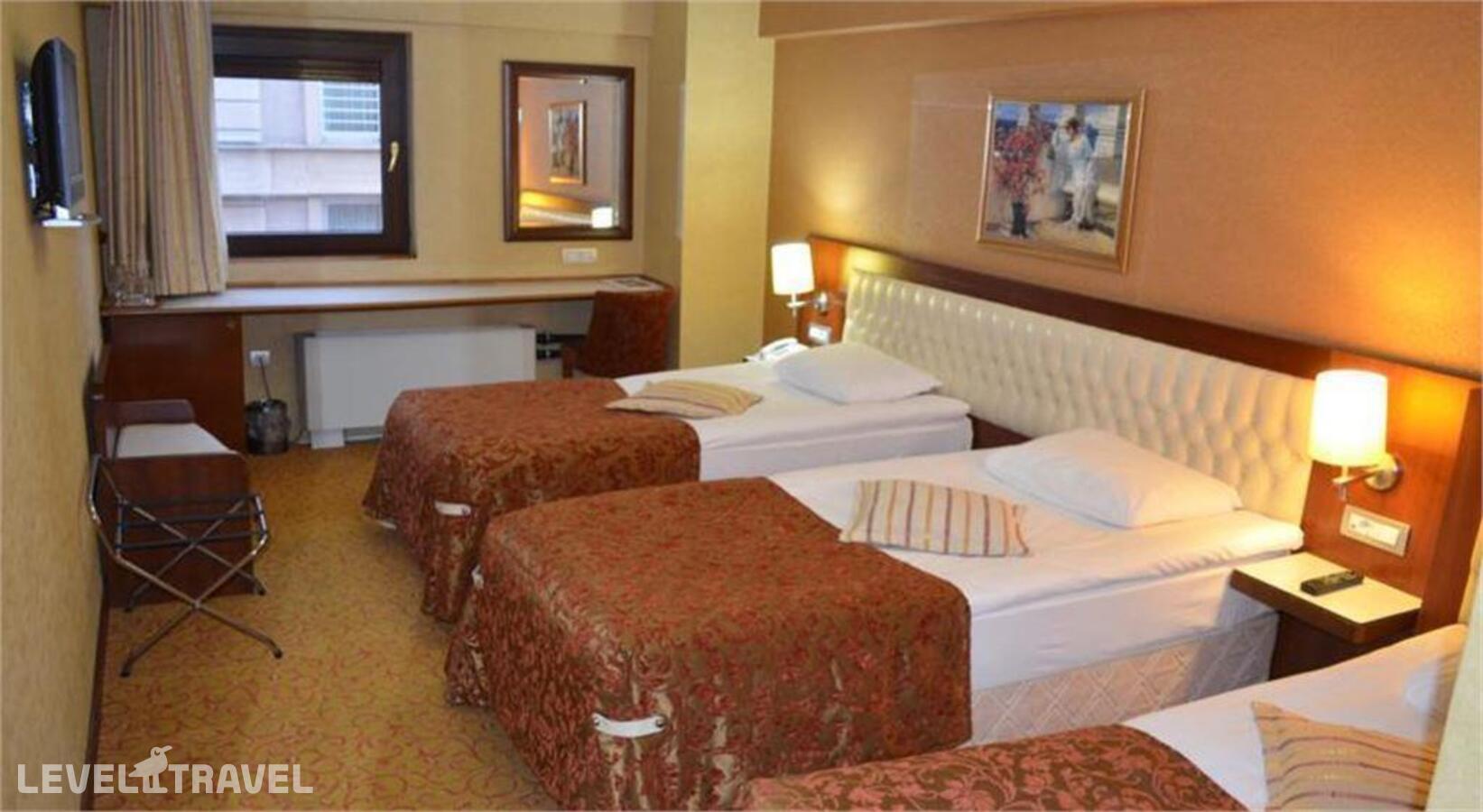 фотографии номера Стандартный номер отеля Yuksel Hotel в Турция(Фатих) - фото №1