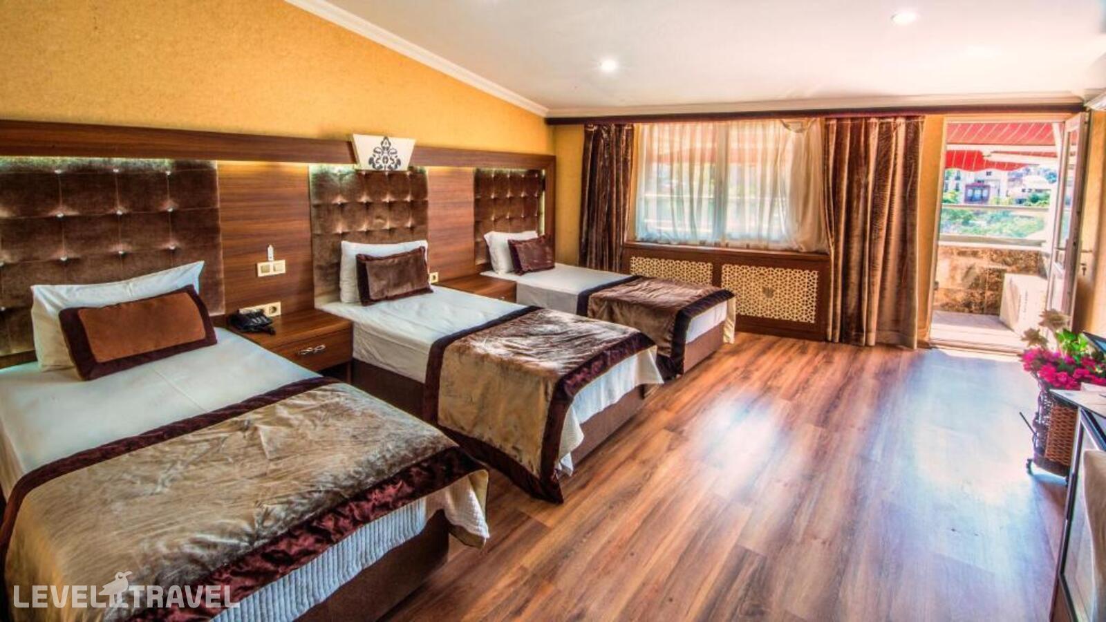 фотографии номера Трехместный с балконом отеля Hera Montagna Hotel в Турция(Шишли) - фото №10