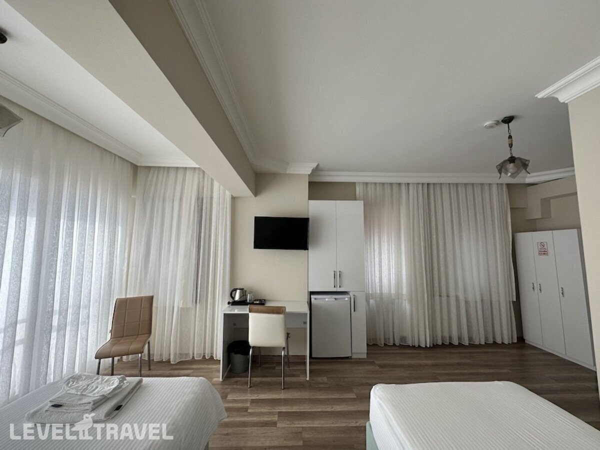 фотографии номера Стандартный номер отеля Doga Villa Guesthouse в Турция(Бююкчекмедже) - фото №11