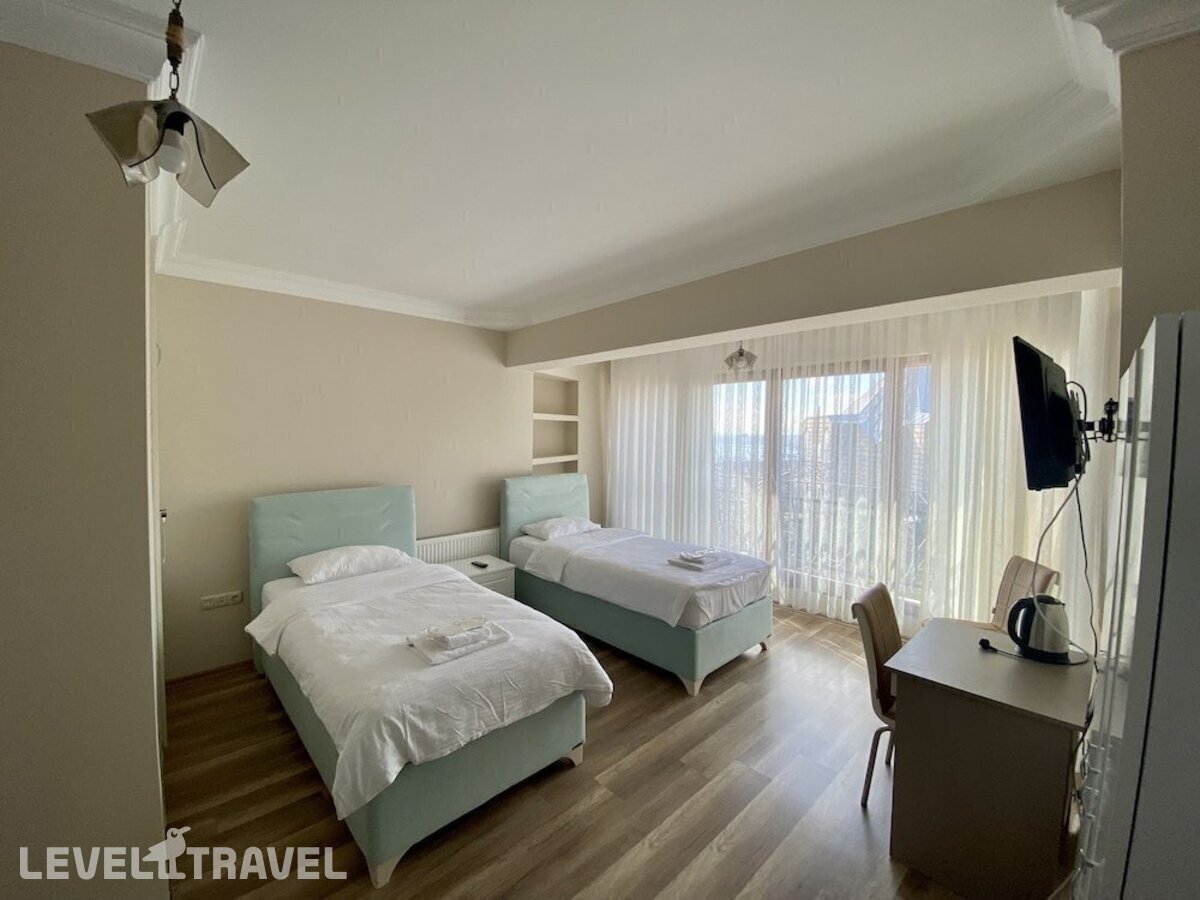 фотографии номера Стандартный номер отеля Doga Villa Guesthouse в Турция(Бююкчекмедже) - фото №2