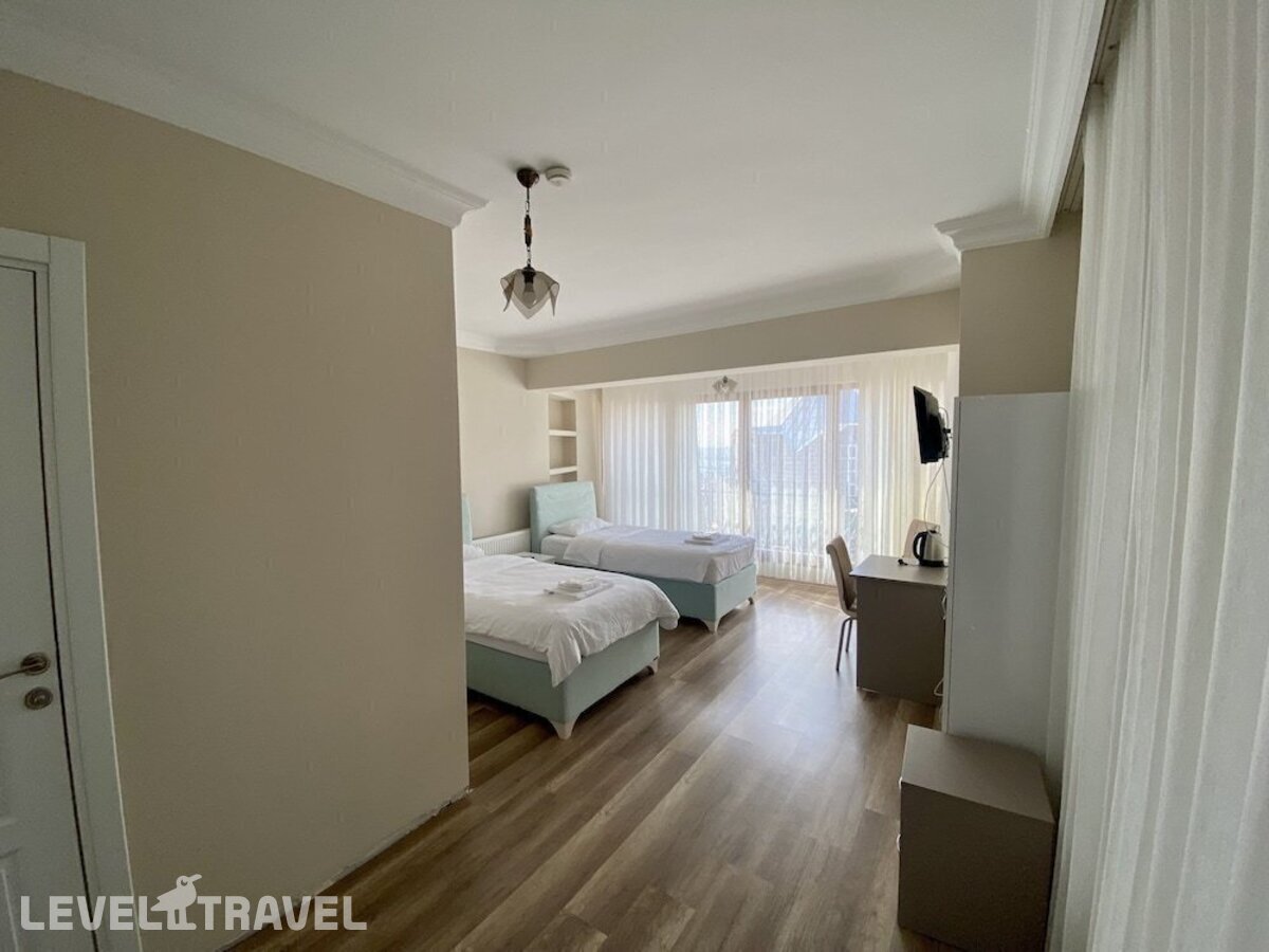 фотографии номера Стандартный номер отеля Doga Villa Guesthouse в Турция(Бююкчекмедже) - фото №1