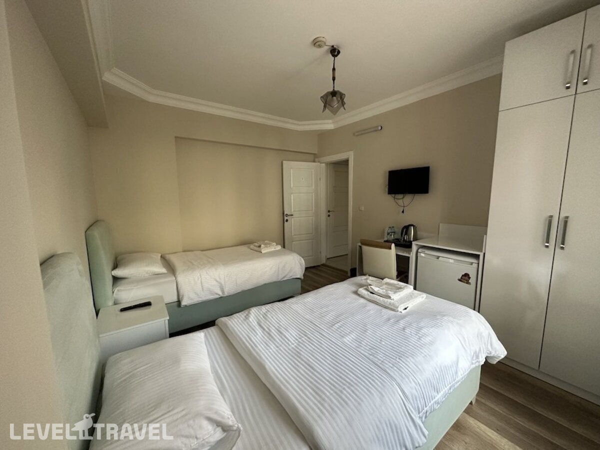 фотографии номера Стандартный номер отеля Doga Villa Guesthouse в Турция(Бююкчекмедже) - фото №4