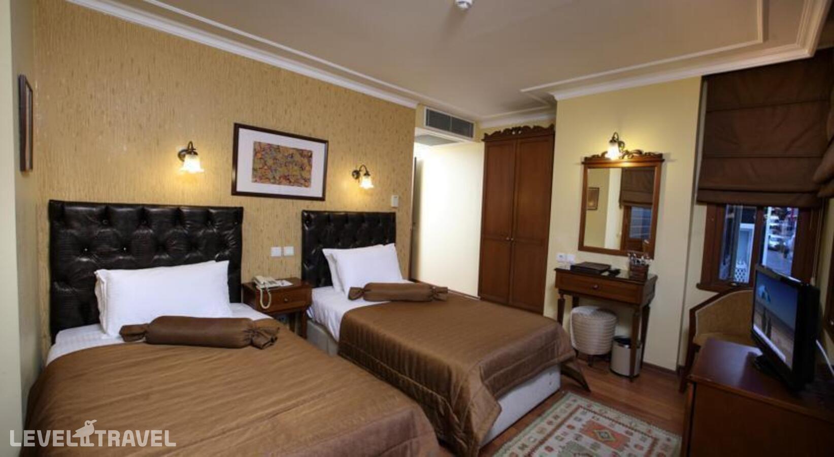 фотографии номера Трехместный номер отеля Yusufpasa Konagi Hotel в Турция(Фатих) - фото №3