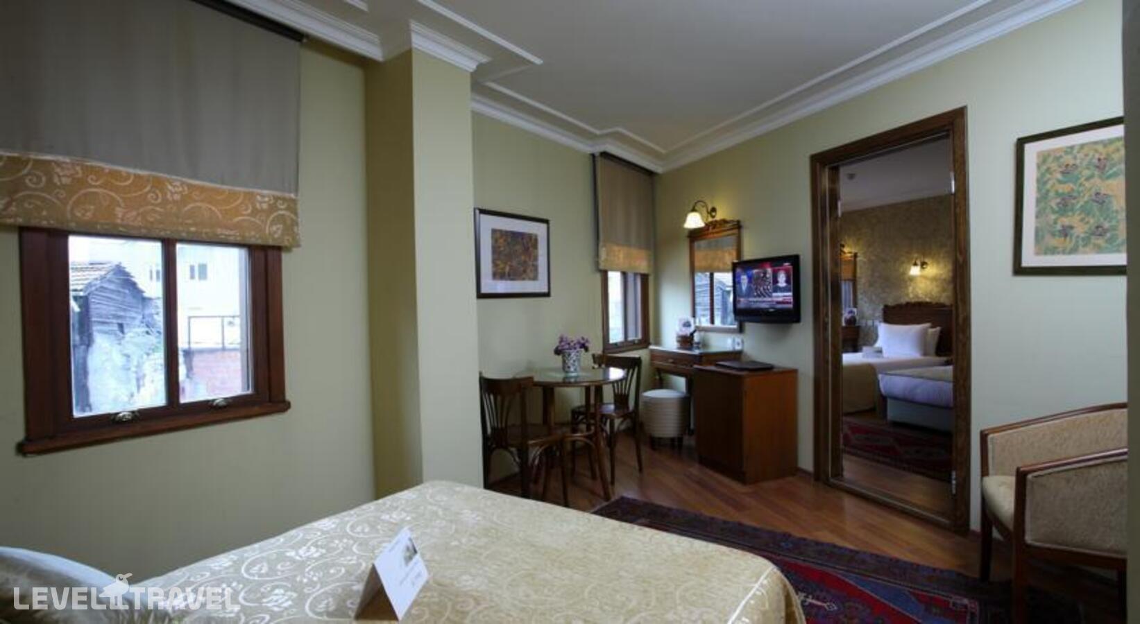 фотографии номера Трехместный номер отеля Yusufpasa Konagi Hotel в Турция(Фатих) - фото №1