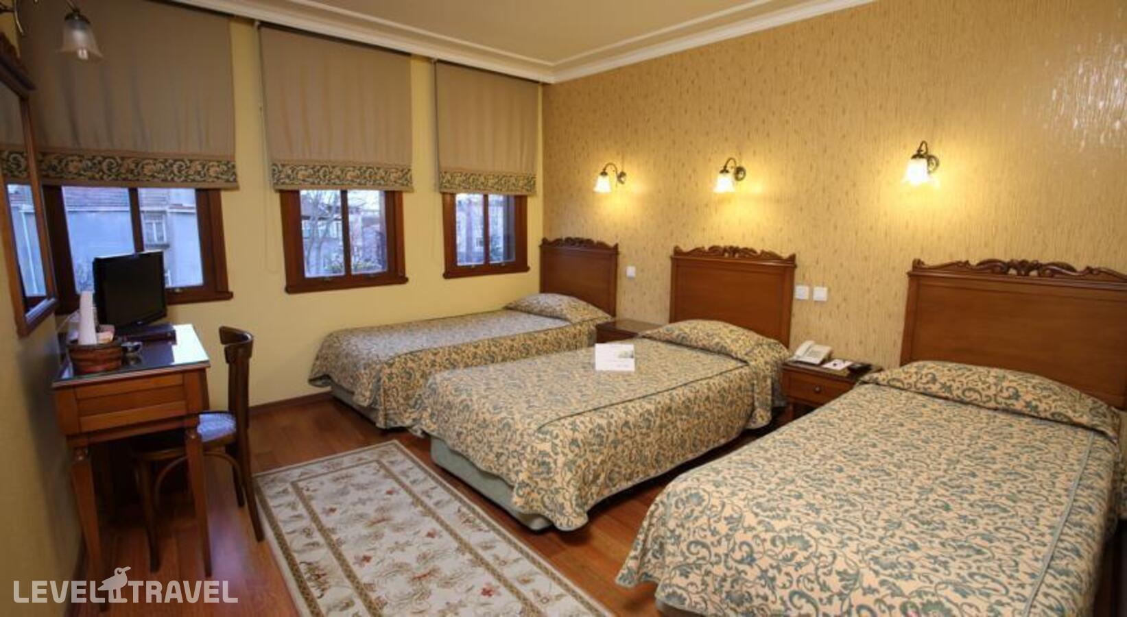 фотографии номера Трехместный номер отеля Yusufpasa Konagi Hotel в Турция(Фатих) - фото №2