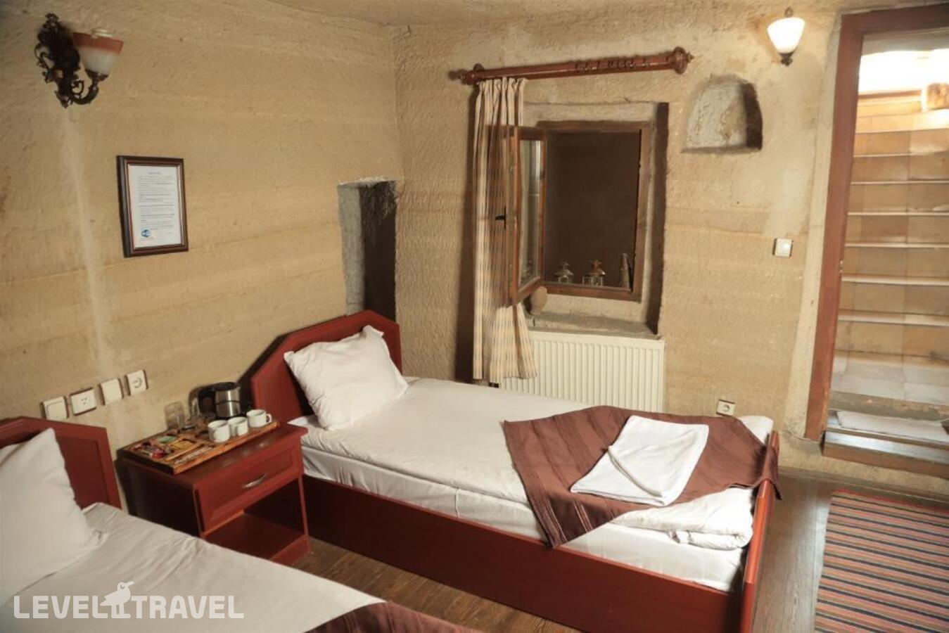 фотографии номера Стандартный номер отеля Guven Cave Hotel в Турция(Гёреме) - фото №3